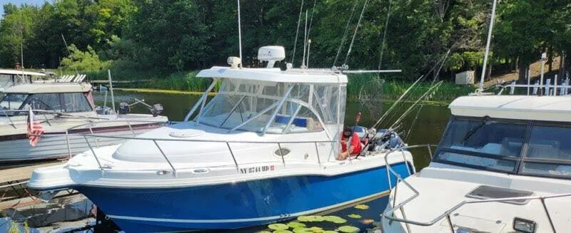 The Image of 2006 Polar Kraft Sportsman Series 27 boat docked in harbor. - 1