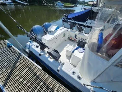 Slide: The Image of 2006 Polar Kraft Sportsman Series 27 boat at dock. - 14