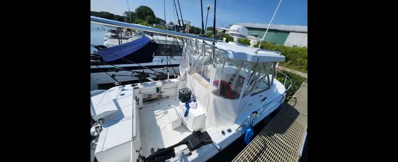 Slide: The Image of 2006 Polar Kraft Sportsman Series 27 boat docked. - 4