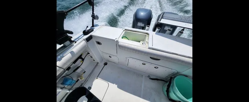 Slide: The Image of Interior view of a 2006 Polar Kraft Sportsman Series 27 boat on water. - 7