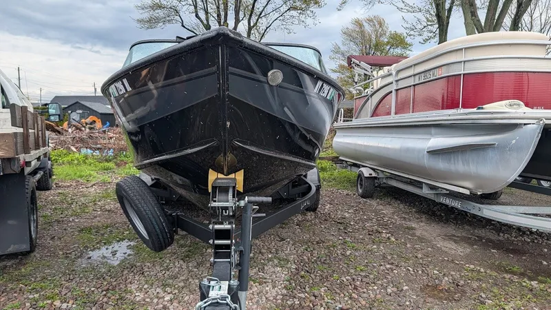 Slide: The Image of 2024 Lund Fisherman 2075 boat parked on trailer. - 5