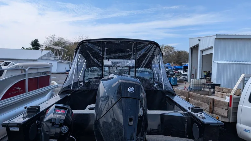 Slide: The Image of 2024 Lund Fisherman 2075 boat with outboard motor at dock. - 7