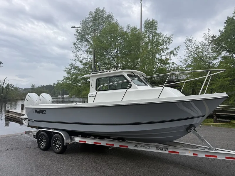 The Image of Parker 247 Explorer 2026 on trailer, Twin 150S engines, air conditioning. - 1