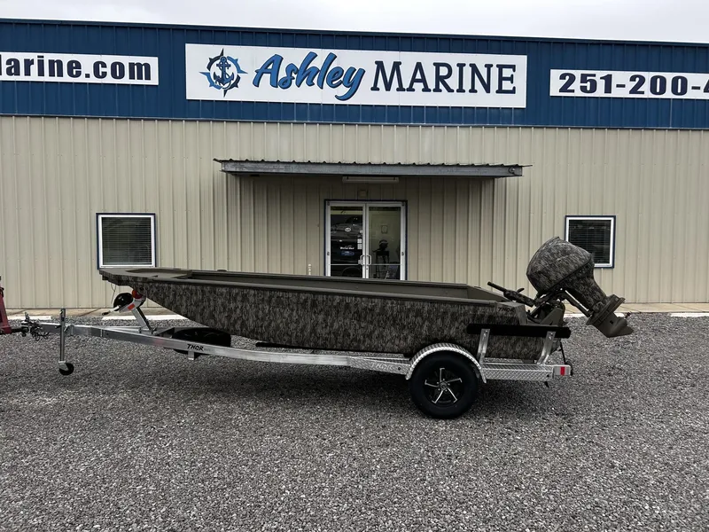 The Image of Thor Timber Hammer 60HP boat outside Ashley Marine building. - 1