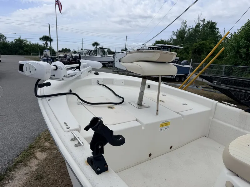 Slide: The Image of 2016 Carolina Skiff JVX18CC with seat and motor on trailer. - 5