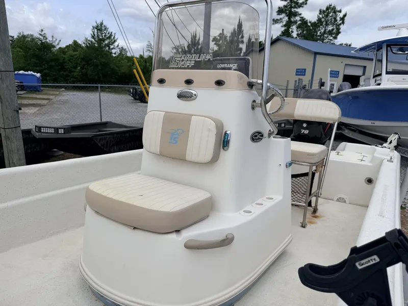 Slide: The Image of 2016 Carolina Skiff JVX18CC boat with console and seating area. - 7
