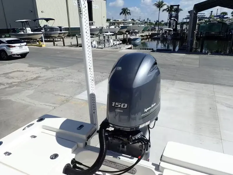 Slide: The Image of 2018 Pathfinder 2200 TRS with Yamaha 150 HP outboard motor at marina. - 14