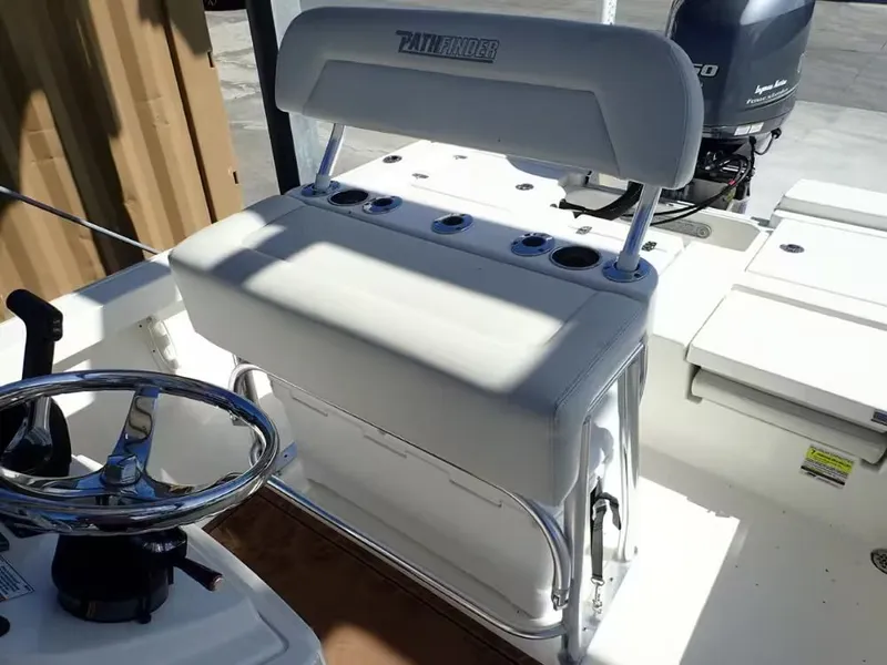 Slide: The Image of Interior view of a 2018 Pathfinder 2200 TRS boat with steering console. - 8