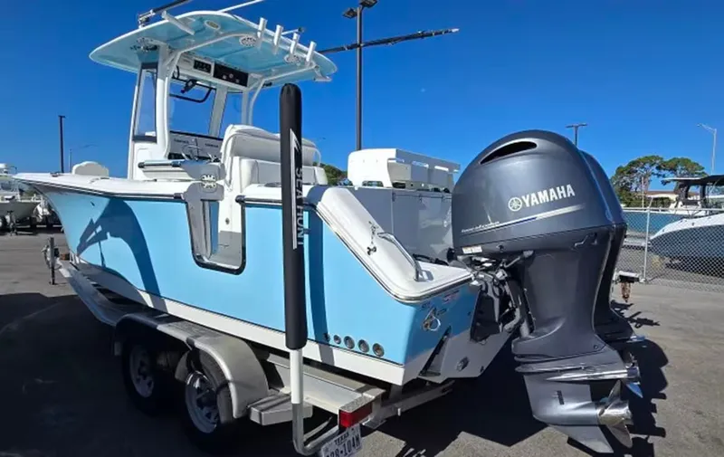 The Image of 2018 Sea Hunt Gamefish 27 with Yamaha engine on trailer. - 1