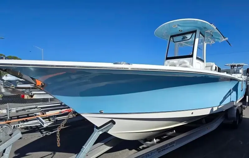 Slide: The Image of 2018 Sea Hunt Gamefish 27 boat on trailer, blue sky. - 3