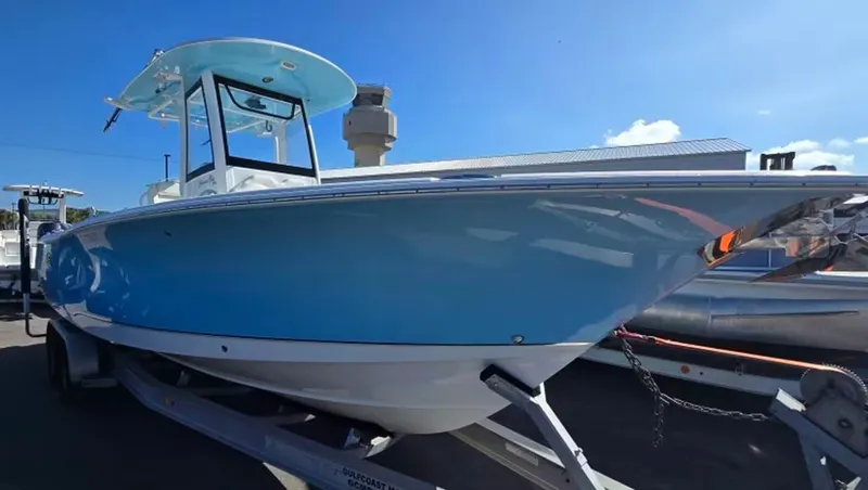 Slide: The Image of 2018 Sea Hunt Gamefish 27 boat on trailer, blue hull. - 4