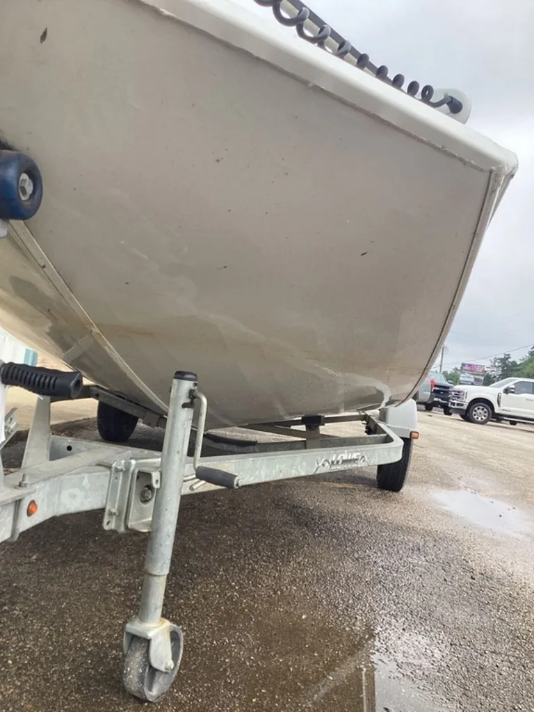 Slide: The Image of 2013 Lowe Stinger 18 HP boat on trailer, close-up view. - 15