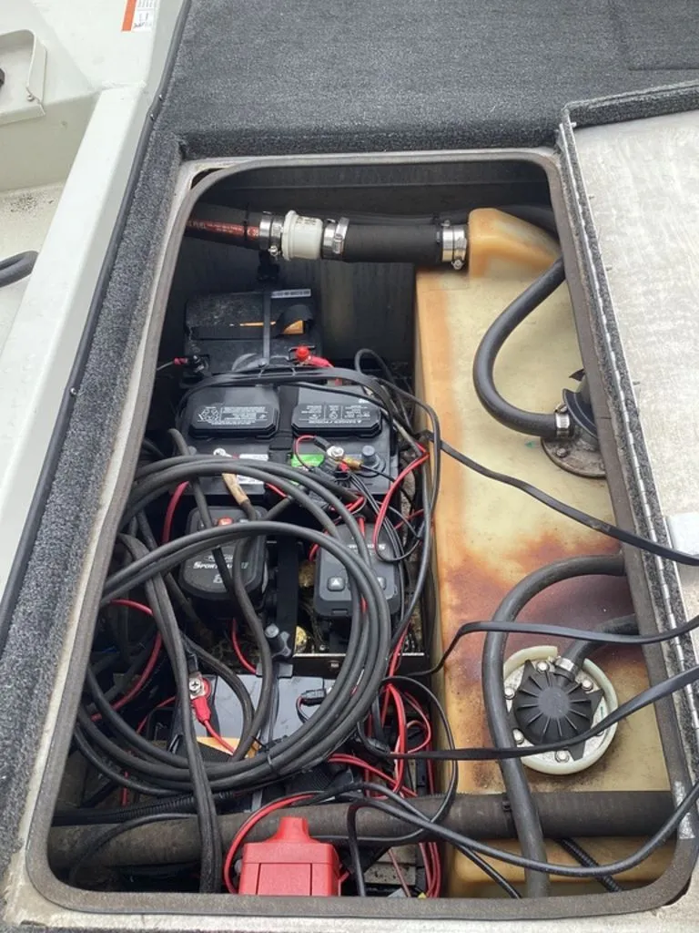 Slide: The Image of View of a 2013 Lowe Stinger 18 HP boat engine compartment. - 22