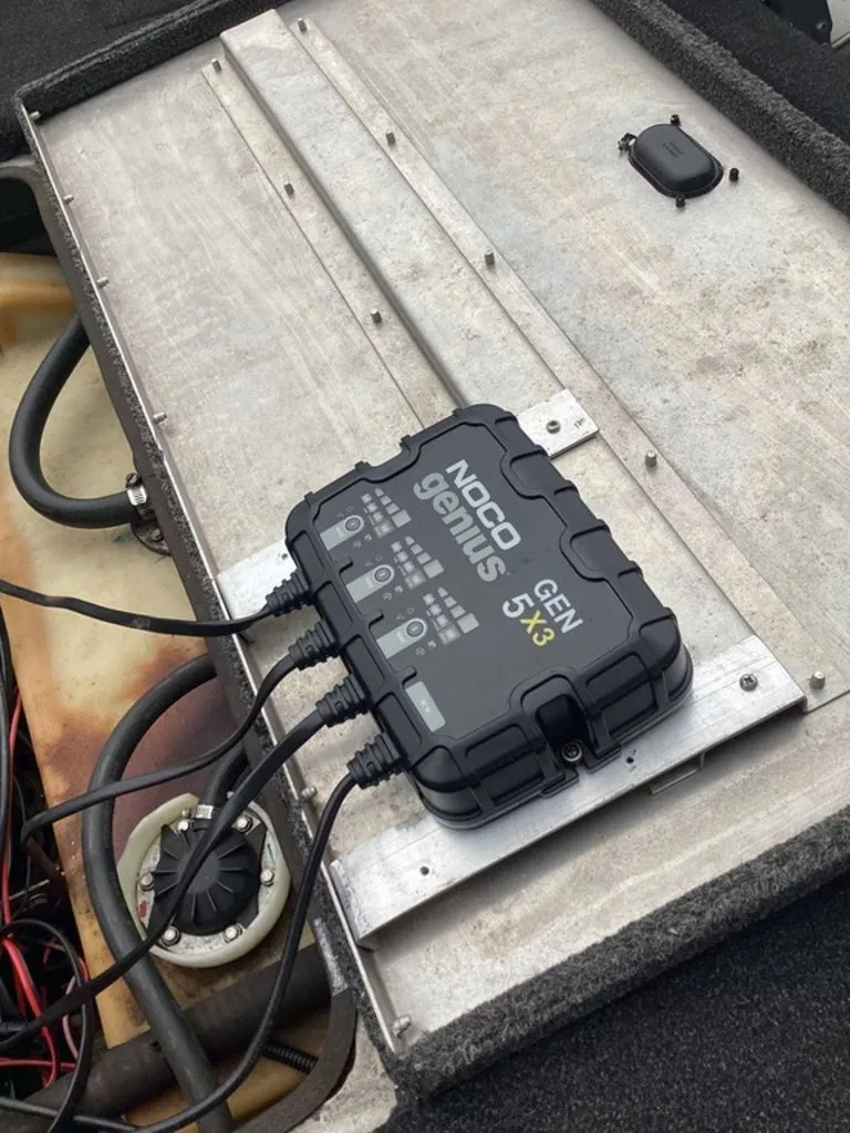 Slide: The Image of NOCO Genius GEN 5X3 charger in Lowe Stinger 18 HP boat. - 23