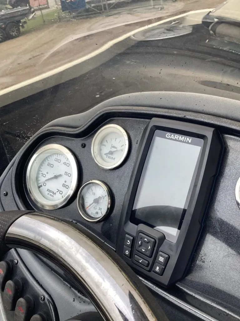 Slide: The Image of Dashboard of a 2013 Lowe Stinger 18 HP with Garmin navigation device. - 24