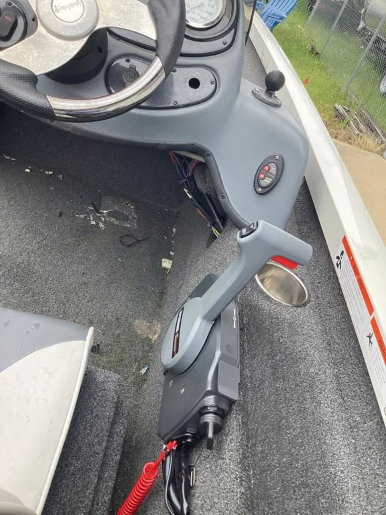 Slide: The Image of Interior of a 2013 Lowe Stinger 18 HP boat with control console. - 26