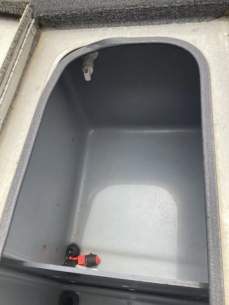 Slide: The Image of Lowe Stinger 18 HP 2013 boat compartment, empty storage space. - 28