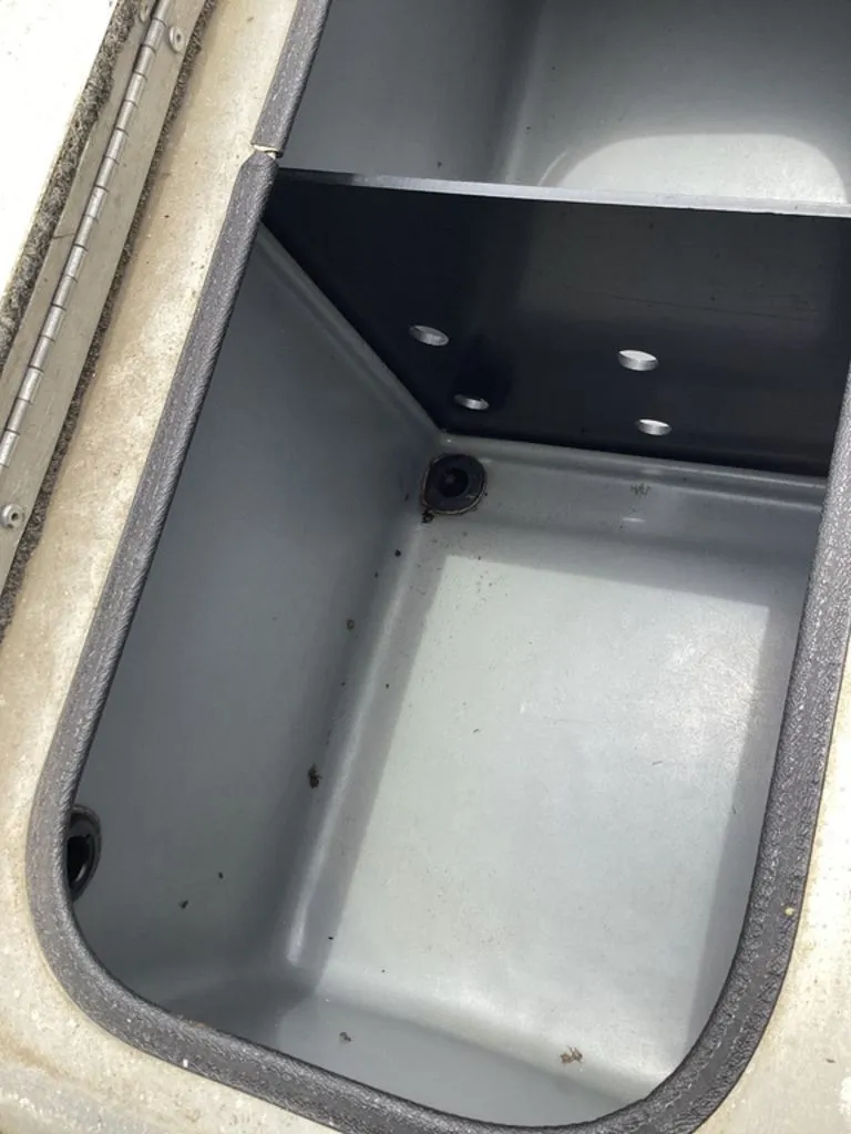 Slide: The Image of Interior view of a 2013 Lowe Stinger 18 HP boat storage compartment. - 29
