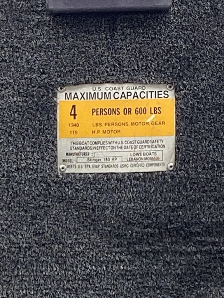 Slide: The Image of US Coast Guard capacity label on Lowe Stinger 18 HP boat. - 30