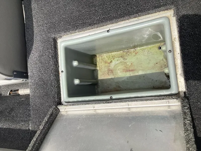 Slide: The Image of Lowe Stinger 18 HP 2013 boat compartment with open storage area. - 33
