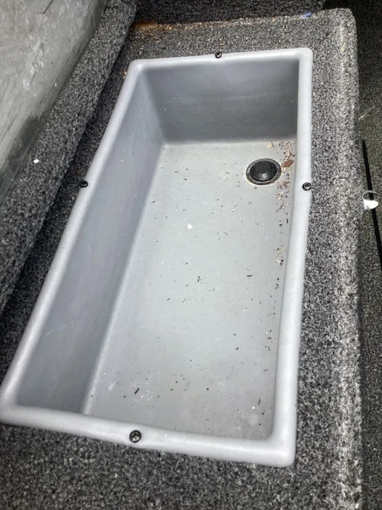 Slide: The Image of Empty storage compartment in 2013 Lowe Stinger 18 HP boat. - 35
