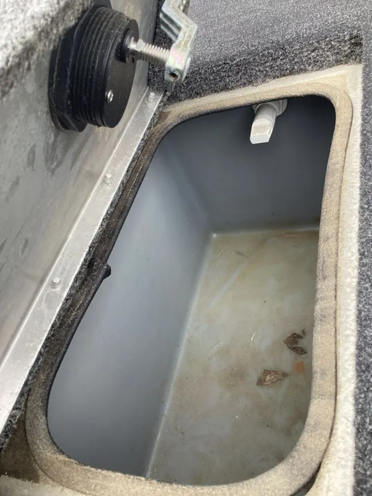 Slide: The Image of Lowe Stinger 18 HP 2013 boat compartment with storage space. - 39