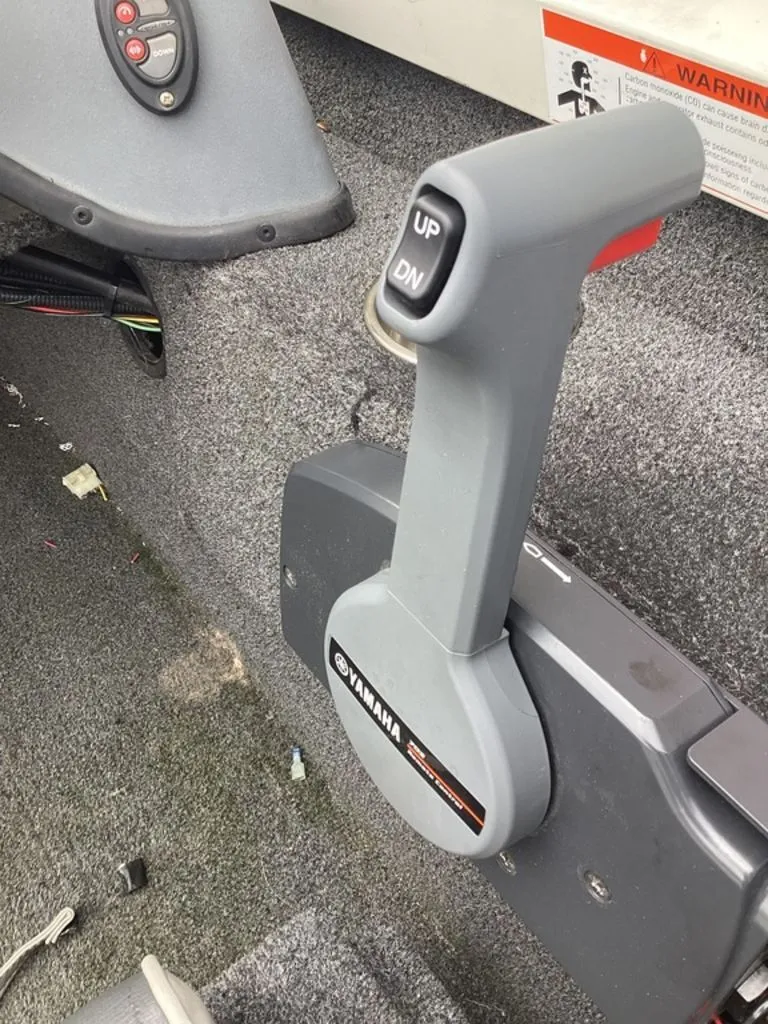 Slide: The Image of Yamaha throttle lever in a 2013 Lowe Stinger 18 HP boat. - 45