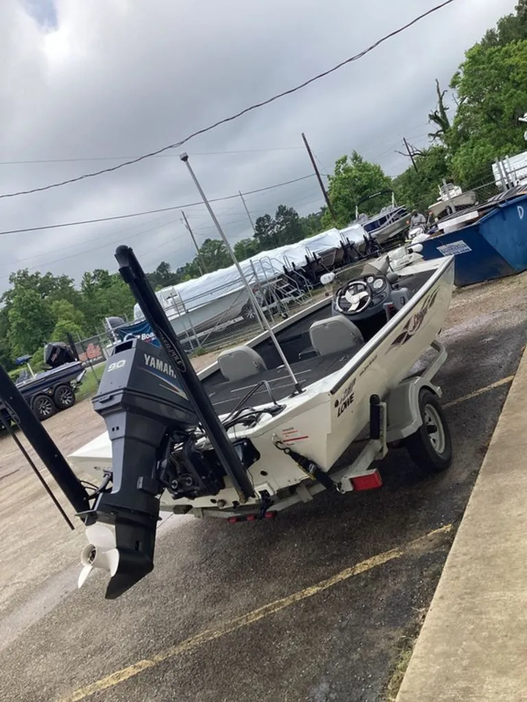 Slide: The Image of 2013 Lowe Stinger 18 HP boat with Yamaha motor on trailer. - 46
