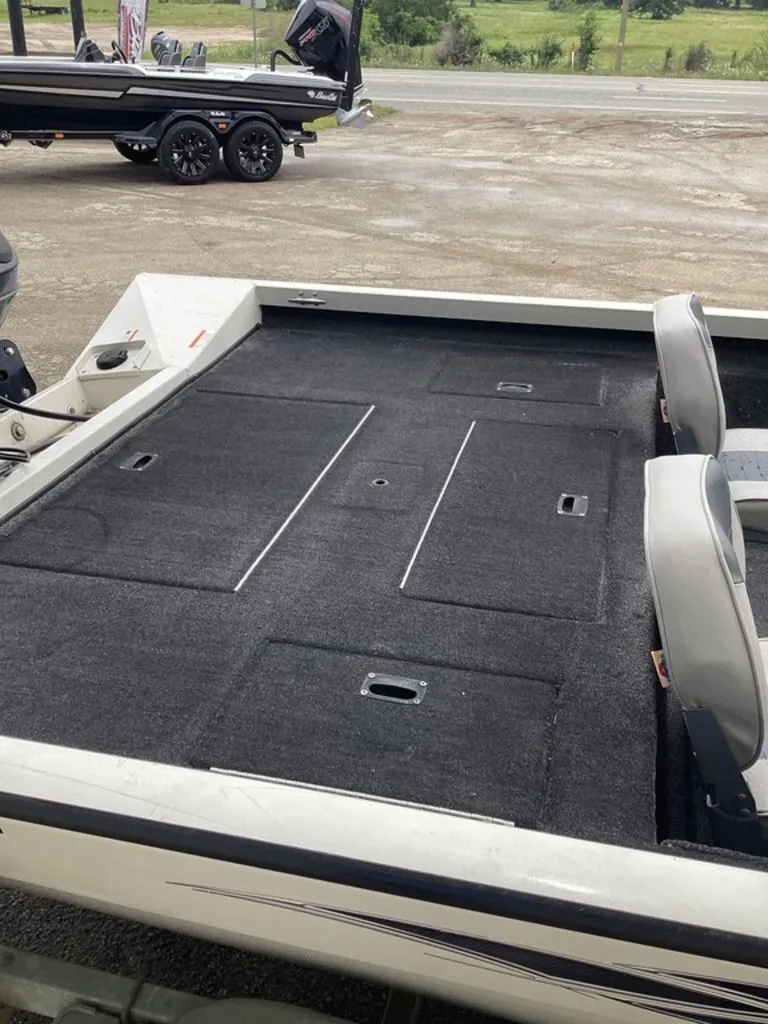 Slide: The Image of 2013 Lowe Stinger 18 HP boat with spacious deck. - 8