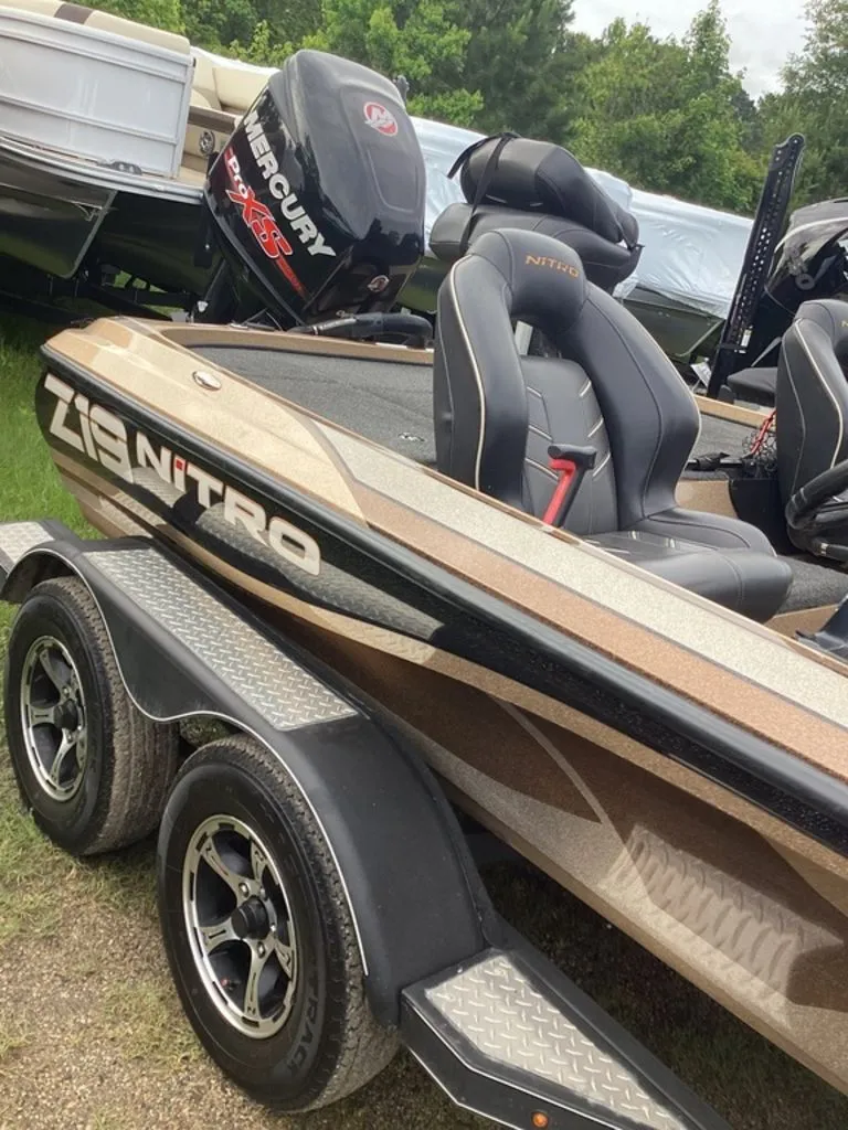 Slide: The Image of 2017 Nitro Z19 boat parked on trailer outdoors. - 3