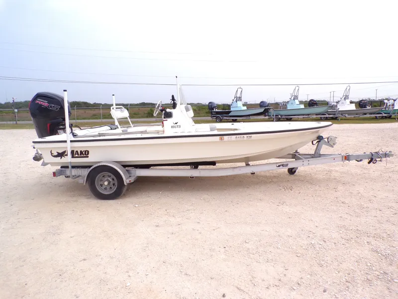 Slide: The Image of 2022 Mako 18 LTS boat on trailer outdoors. - 16