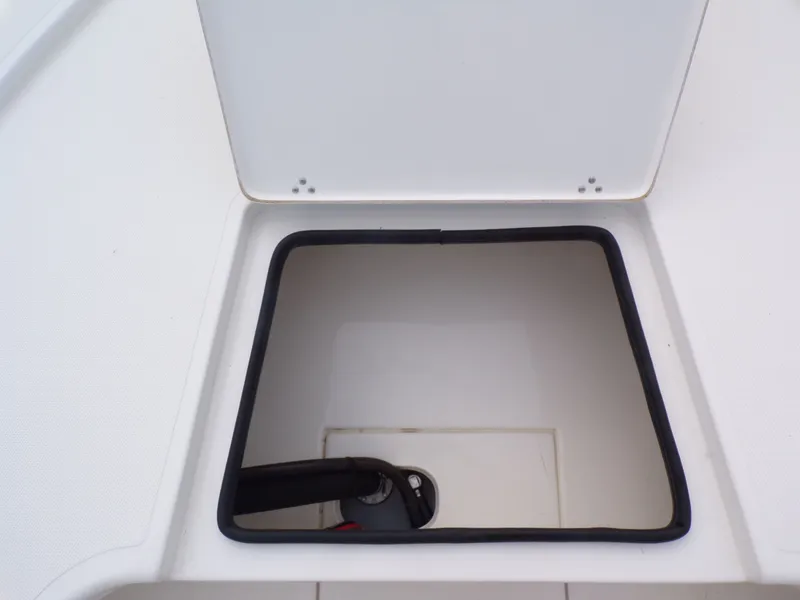 Slide: The Image of Open storage compartment on a 2022 Mako 18 LTS boat. - 8