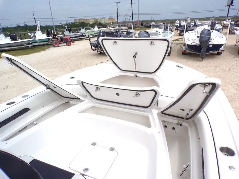 Slide: The Image of Tidewater 2500 Carolina Bay 2026 with open storage compartments at the dock. - 6