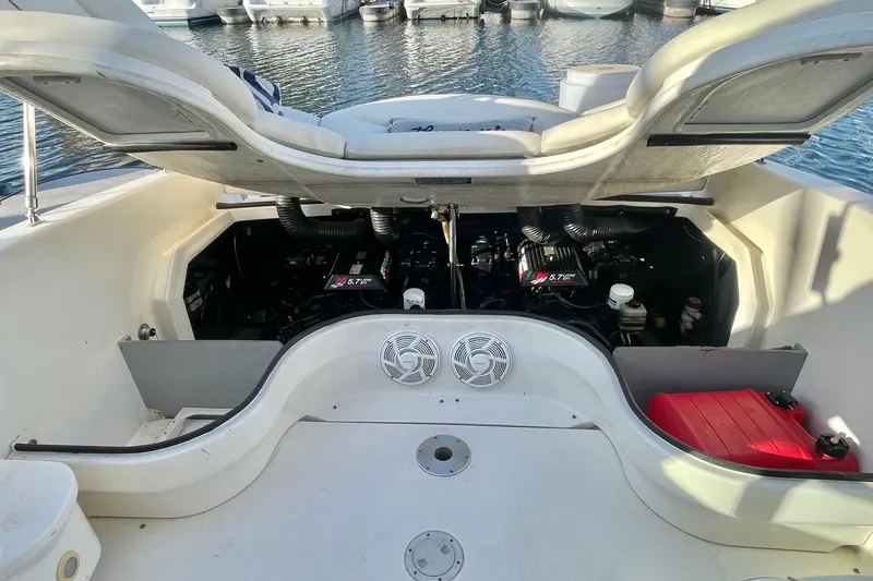Slide: The Image of 2001 Sea Ray 280 boat engine compartment with open hatch, revealing dual 5.7L engines. - 19