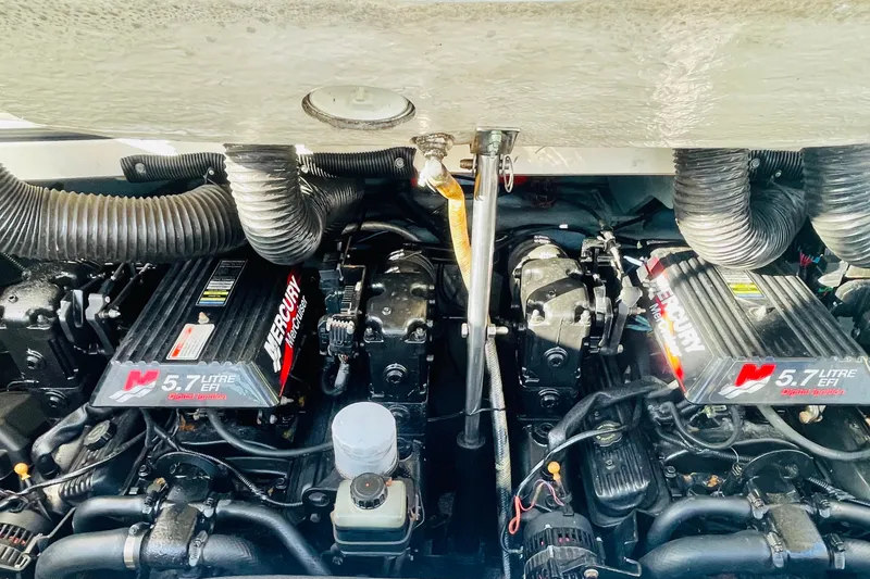Slide: The Image of Twin Mercury 5.7L EFI engines in a 2001 Sea Ray 280 boat. - 21