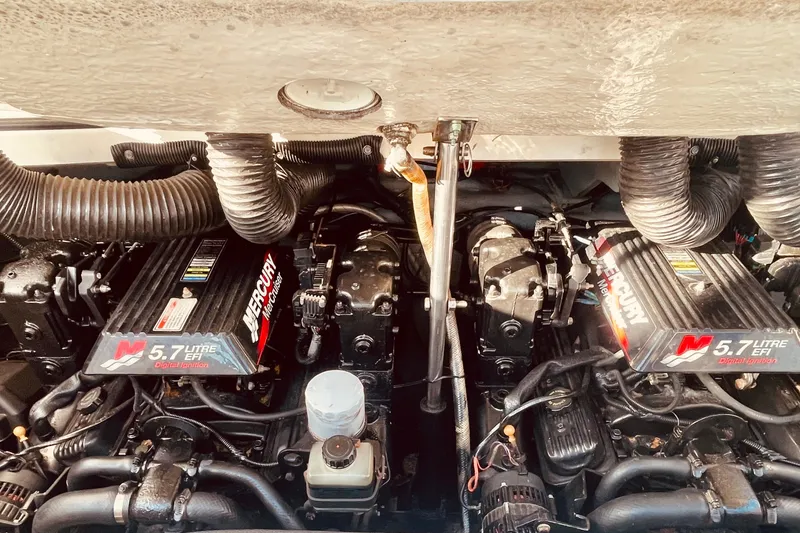 Slide: The Image of Twin Mercury engines in a 2001 Sea Ray 280 boat, showcasing 5.7-liter EFI digital ignition. - 26
