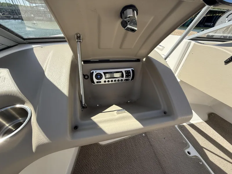 Slide: The Image of Interior of a 2011 Larson LX850 boat with radio. - 14