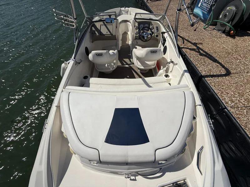 Slide: The Image of Interior view of a 2011 Larson LX850 boat at the dock. - 19