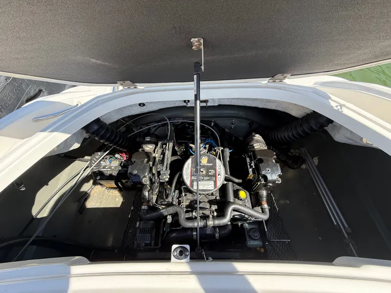 Slide: The Image of Engine compartment of a 2011 Larson LX850 boat with open hatch. - 26