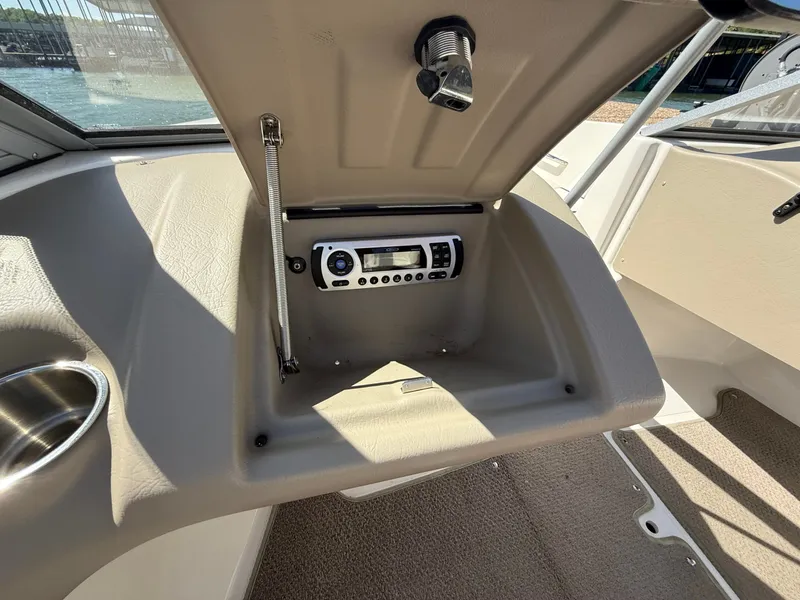 Slide: The Image of Interior of a 2011 Larson LX850 boat with radio. - 27