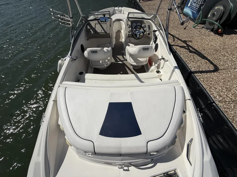 Slide: The Image of Interior view of a 2011 Larson LX850 boat at the dock. - 6