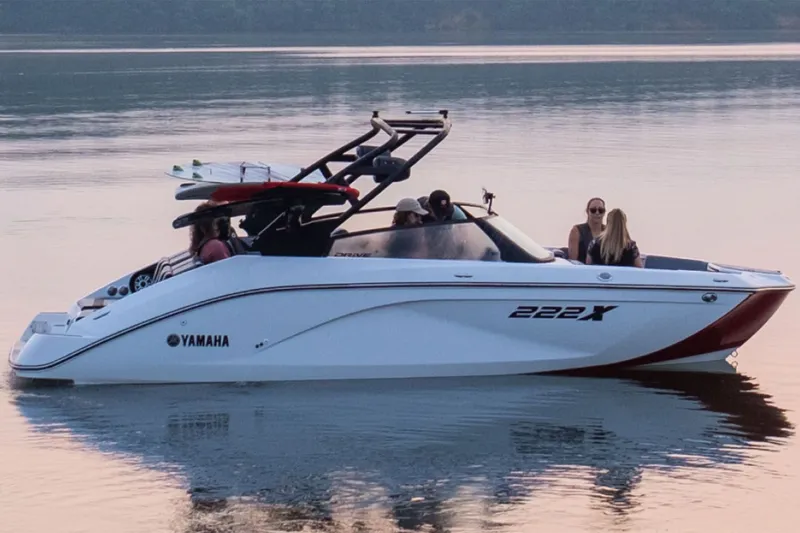 Slide: The Image of 2026 Yamaha Boats 222XD on calm water at sunset. - 10
