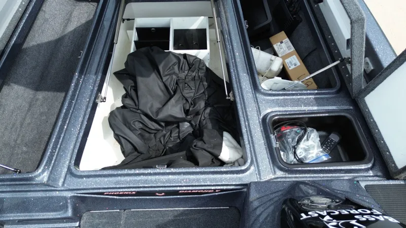 Slide: The Image of Interior view of a 2021 Phoenix 921 Elite boat storage compartment. - 17