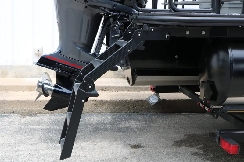 Slide: The Image of Sylvan L3 RLZ Tri Toon 2026 with motor and ladder. - 13