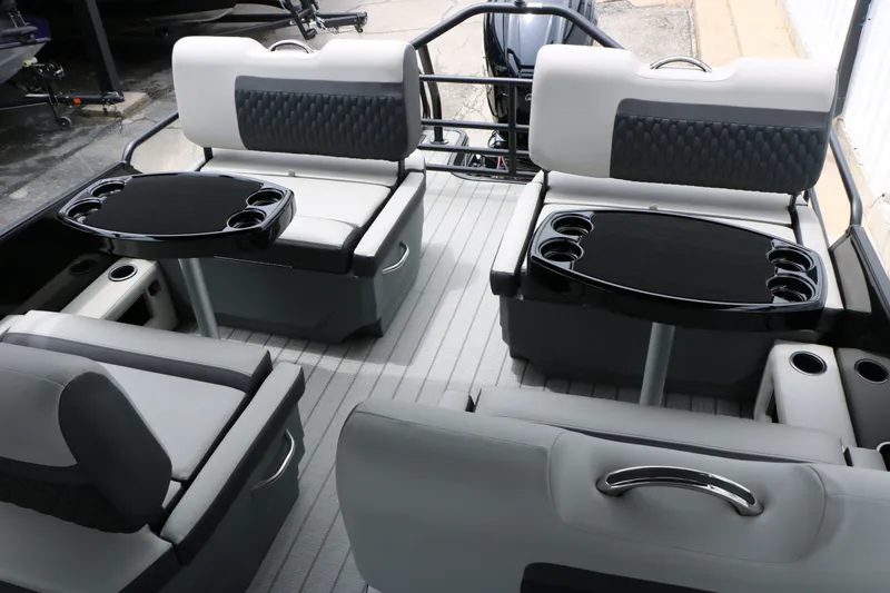 Slide: The Image of Interior of 2026 Sylvan L3 RLZ Tri Toon with seating and tables. - 19