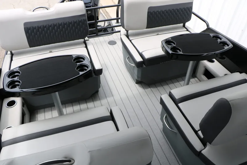 Slide: The Image of Interior of 2026 Sylvan L3 RLZ Tri Toon with modern seating and tables. - 20