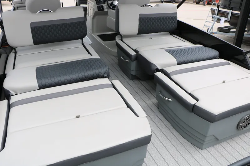 Slide: The Image of Interior of 2026 Sylvan L3 RLZ Tri Toon with luxurious seating. - 26