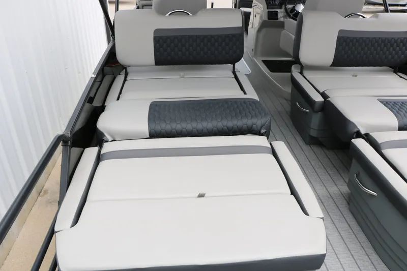 Slide: The Image of Interior of 2026 Sylvan L3 RLZ Tri Toon with luxurious seating. - 28
