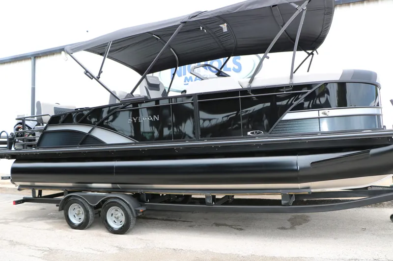Slide: The Image of 2026 Sylvan L3 RLZ Tri Toon pontoon boat on trailer. - 3