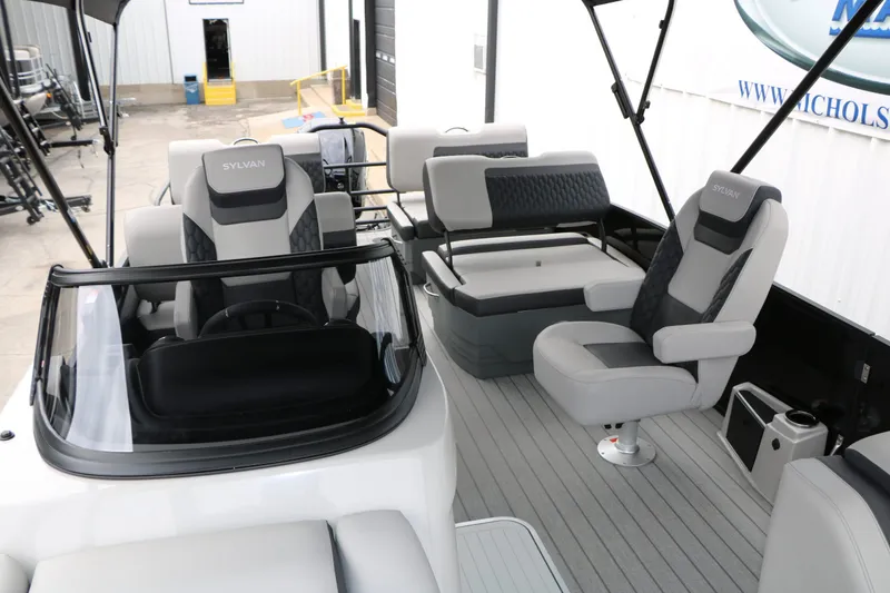Slide: The Image of Interior of 2026 Sylvan L3 RLZ Tri Toon with luxurious seating. - 48